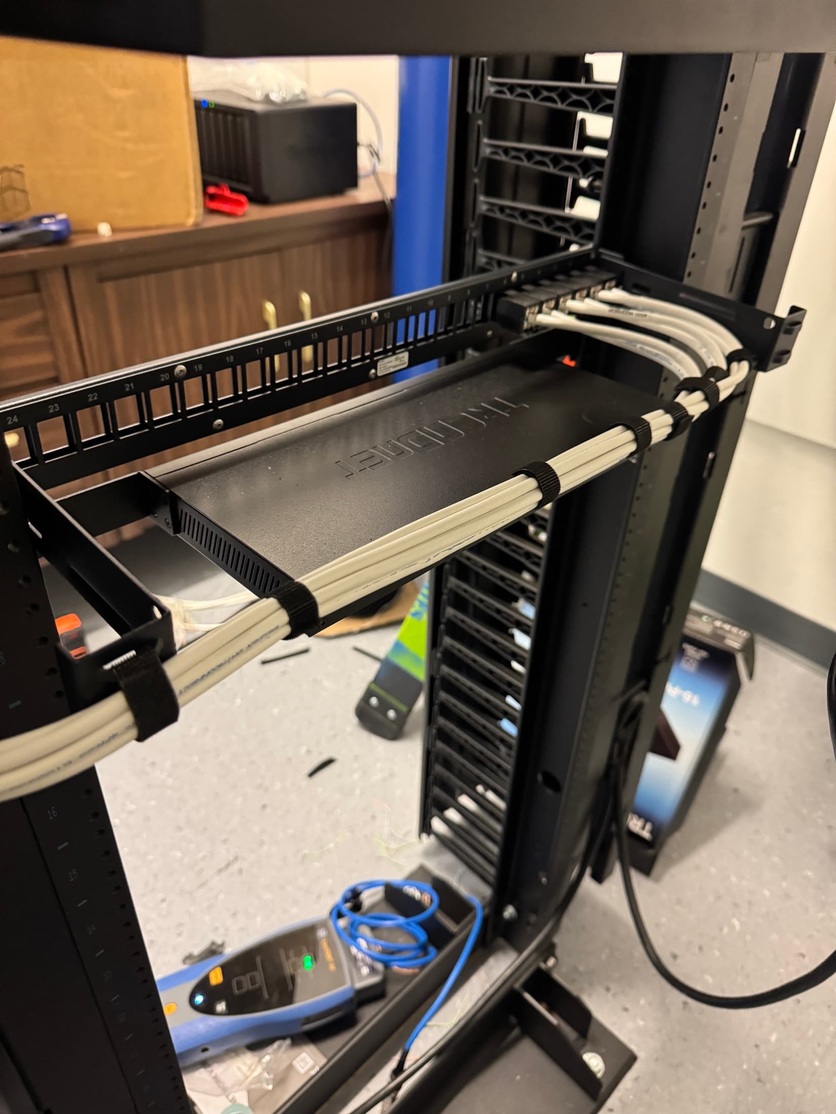 Structured cabling work inside a commercial low-voltage rack