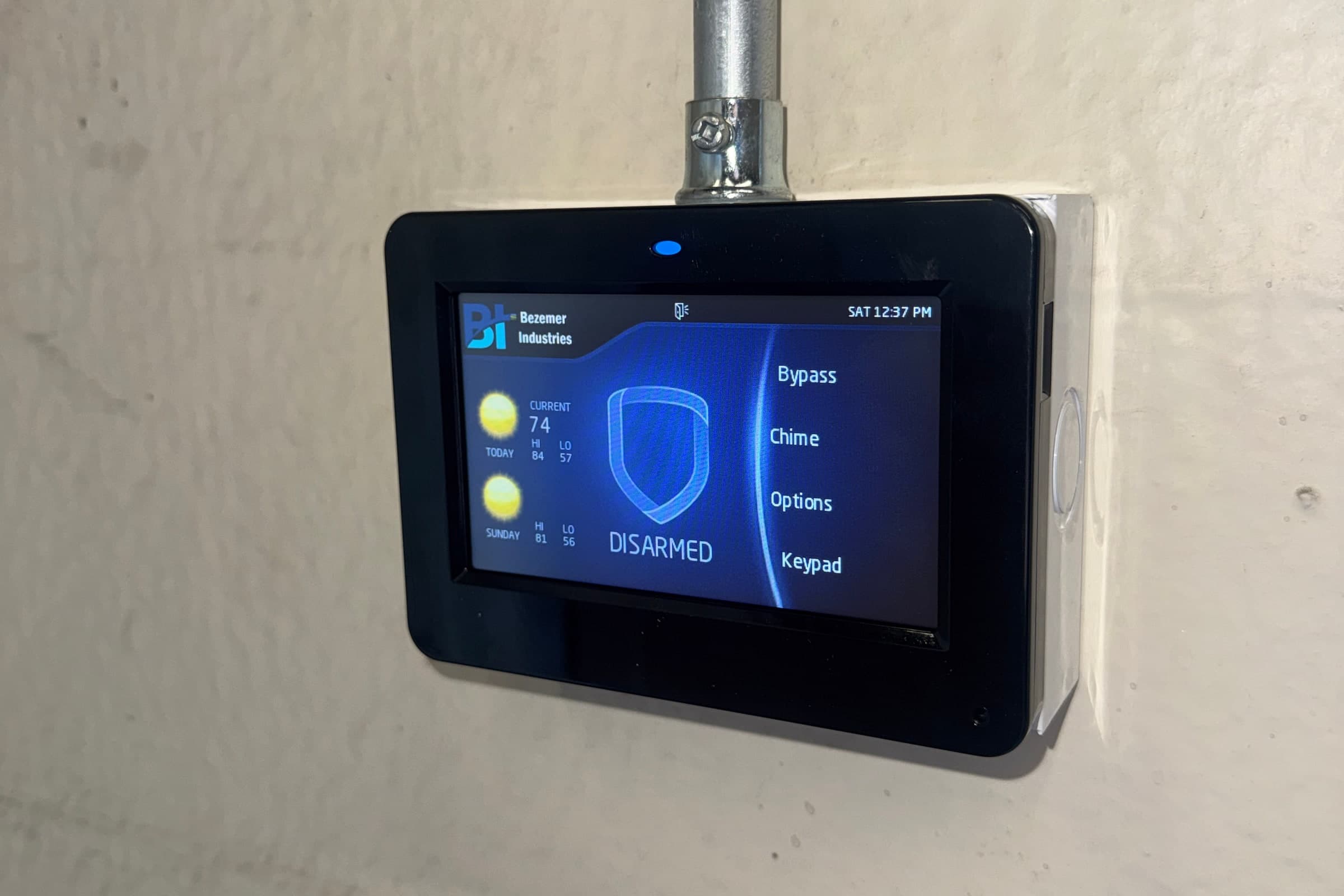 Commercial security alarm keypad mounted on a wall