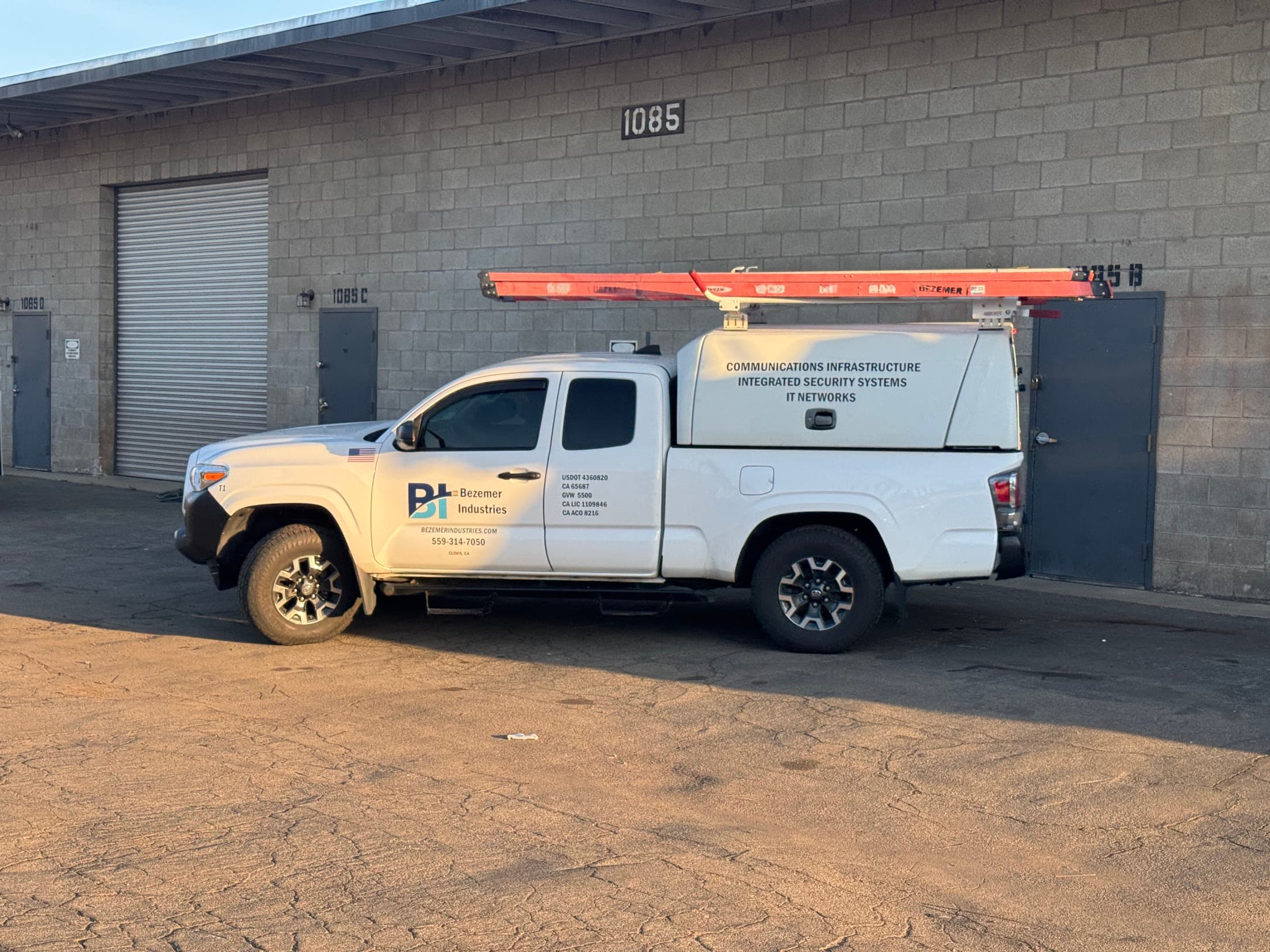 Bezemer Industries branded service truck outside the Clovis shop
